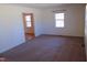 Living room with view to second room with carpeted floors and a window at 3601 Colonial Ln, Rocky Mount, NC 27804
