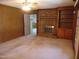 Living room features a brick fireplace, built-in shelving and access to other rooms at 3601 Colonial Ln, Rocky Mount, NC 27804