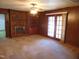 Living room features a brick fireplace, built-in shelving and sliding glass doors at 3601 Colonial Ln, Rocky Mount, NC 27804