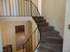View from the upper landing to the staircase, fireplace and entry at 3601 Colonial Ln, Rocky Mount, NC 27804