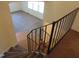 View down stairwell, showing stairs and living area with natural light at 3601 Colonial Ln, Rocky Mount, NC 27804