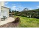 Backyard featuring green space, shrubbery and a small patio at 3615 Ramblewood Ave, Durham, NC 27713