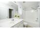 Bright bathroom featuring a white vanity and shower-tub combination at 3615 Ramblewood Ave, Durham, NC 27713