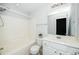 Bathroom featuring a white vanity and shower-tub combination at 3615 Ramblewood Ave, Durham, NC 27713