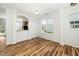 Open dining area with hardwood floors and views into the kitchen at 3615 Ramblewood Ave, Durham, NC 27713