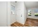 Bright entryway with wood floors, fresh white paint and natural light at 3615 Ramblewood Ave, Durham, NC 27713