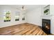 Bright living room with hardwood floors, fireplace, and lots of natural light at 3615 Ramblewood Ave, Durham, NC 27713