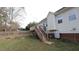This backyard has a wooden deck and a view of the home's exterior at 392 Travel Lite Dr, Raleigh, NC 27603