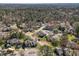 Expansive aerial view of a residential neighborhood with mature trees and well-maintained lawns at 4 Applewood Sq, Durham, NC 27713