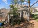 Backyard featuring a deck and mature tree at 4 Applewood Sq, Durham, NC 27713