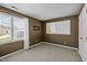 Bedroom with window, white blinds, and mocha brown wall paint at 4 Applewood Sq, Durham, NC 27713