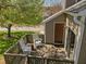 Cozy outdoor deck with rocking chairs and view of the yard at 4 Applewood Sq, Durham, NC 27713
