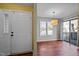 Inviting entryway with beautiful flooring, natural light, front door, and open floor plan at 4 Applewood Sq, Durham, NC 27713