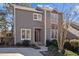 Charming townhouse features a well-maintained exterior with neutral siding, complemented by mature landscaping at 4 Applewood Sq, Durham, NC 27713