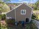 Exterior view of the house, featuring a deck and mature trees at 4 Applewood Sq, Durham, NC 27713