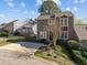 Exterior of home featuring landscaping, a private entrance and mature tree at 4 Applewood Sq, Durham, NC 27713