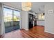 Open floor plan featuring a kitchen and dining area with access to an outdoor deck through sliding glass doors at 4 Applewood Sq, Durham, NC 27713