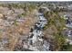 Overhead view of condos nestled among dense trees and snow-dusted landscape at 4631 Timbermill Ct # 301, Raleigh, NC 27612