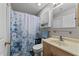 Cozy bathroom featuring a shower with a curtain, a vanity, and modern fixtures at 4631 Timbermill Ct # 301, Raleigh, NC 27612