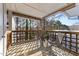 Relaxing outdoor deck with seating and a peaceful view of the surrounding trees at 4631 Timbermill Ct # 301, Raleigh, NC 27612