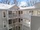 Stylish condo building with three levels of balconies and winter snow at 4631 Timbermill Ct # 301, Raleigh, NC 27612