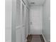 Hallway with coat closet and neutral decor at 4631 Timbermill Ct # 301, Raleigh, NC 27612