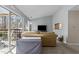 Bright living room with a sliding glass door, plush seating, and a view of the kitchen at 4631 Timbermill Ct # 301, Raleigh, NC 27612