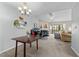 Open living room with a fireplace and access to outdoor deck at 4631 Timbermill Ct # 301, Raleigh, NC 27612
