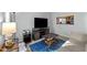 Comfortable living room with a TV, sofa, an open view to the kitchen, and a relaxing atmosphere at 4631 Timbermill Ct # 301, Raleigh, NC 27612