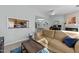 Inviting living room featuring a comfortable sofa, an open view to the kitchen, and a cozy atmosphere at 4631 Timbermill Ct # 301, Raleigh, NC 27612