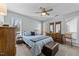 Serene main bedroom with a ceiling fan, two windows, a queen bed and ample closet space at 4631 Timbermill Ct # 301, Raleigh, NC 27612