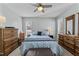 Comfortable main bedroom featuring neutral colors, ceiling fan, and ample closet space at 4631 Timbermill Ct # 301, Raleigh, NC 27612