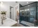 Luxurious bathroom showcasing a glass-enclosed shower with eye-catching tile design at 4706 Cypress Tree Ln, Raleigh, NC 27612