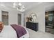 Spacious bedroom with modern lighting, ample closet space, and ensuite bathroom at 4706 Cypress Tree Ln, Raleigh, NC 27612
