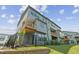 New construction home with outdoor balcony overlooking a green lawn and new privacy fence at 4706 Cypress Tree Ln, Raleigh, NC 27612