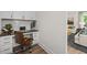 Functional home office nook with built-in desk, cabinets, and natural light at 4706 Cypress Tree Ln, Raleigh, NC 27612