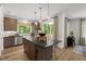 Open kitchen area with stainless appliances, island seating and abundant storage at 4706 Cypress Tree Ln, Raleigh, NC 27612