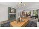 Stylish living room with a modern fireplace, open layout, and dining area at 4706 Cypress Tree Ln, Raleigh, NC 27612