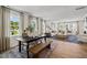 Open-concept living space with wood floors, dining area and a comfortable living room at 4706 Cypress Tree Ln, Raleigh, NC 27612