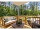Outdoor patio with comfortable seating, stylish decor, and a view of the surrounding landscape at 4706 Cypress Tree Ln, Raleigh, NC 27612