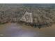 Aerial view of lakefront property highlighting the expansive lot and lake access at 4808 Clubview Ct, Fuquay Varina, NC 27526