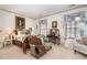 Cozy bedroom featuring a comfortable bed, antique writing desk, and a tranquil atmosphere for relaxation at 4808 Clubview Ct, Fuquay Varina, NC 27526