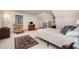 Cozy bedroom featuring a quaint seating area, complemented by soft lighting and a patterned rug at 4808 Clubview Ct, Fuquay Varina, NC 27526