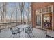 Outdoor dining area on a deck overlooking a lake, accessible from the dining room at 4808 Clubview Ct, Fuquay Varina, NC 27526