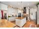 Well-lit kitchen with butcher block island, stylish appliances, and ample cabinet space, ideal for cooking and entertaining at 4808 Clubview Ct, Fuquay Varina, NC 27526