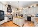 Bright eat-in kitchen featuring stainless appliances, a wood-topped island, and abundant cabinet storage at 4808 Clubview Ct, Fuquay Varina, NC 27526