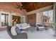 Outdoor patio with brick exterior and cozy seating, perfect for entertaining or enjoying the fresh air at 4808 Clubview Ct, Fuquay Varina, NC 27526