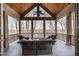 Relaxing screened-in porch with comfortable seating, a ceiling fan, and views of the surrounding landscape at 4808 Clubview Ct, Fuquay Varina, NC 27526