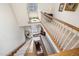 Elegant staircase featuring wood railings, carpeted steps, and a view of the home's interior design at 4808 Clubview Ct, Fuquay Varina, NC 27526