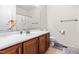 Bathroom vanity with a white countertop and a large mirror, complemented by neutral walls at 4963 Highcroft Dr, Cary, NC 27519